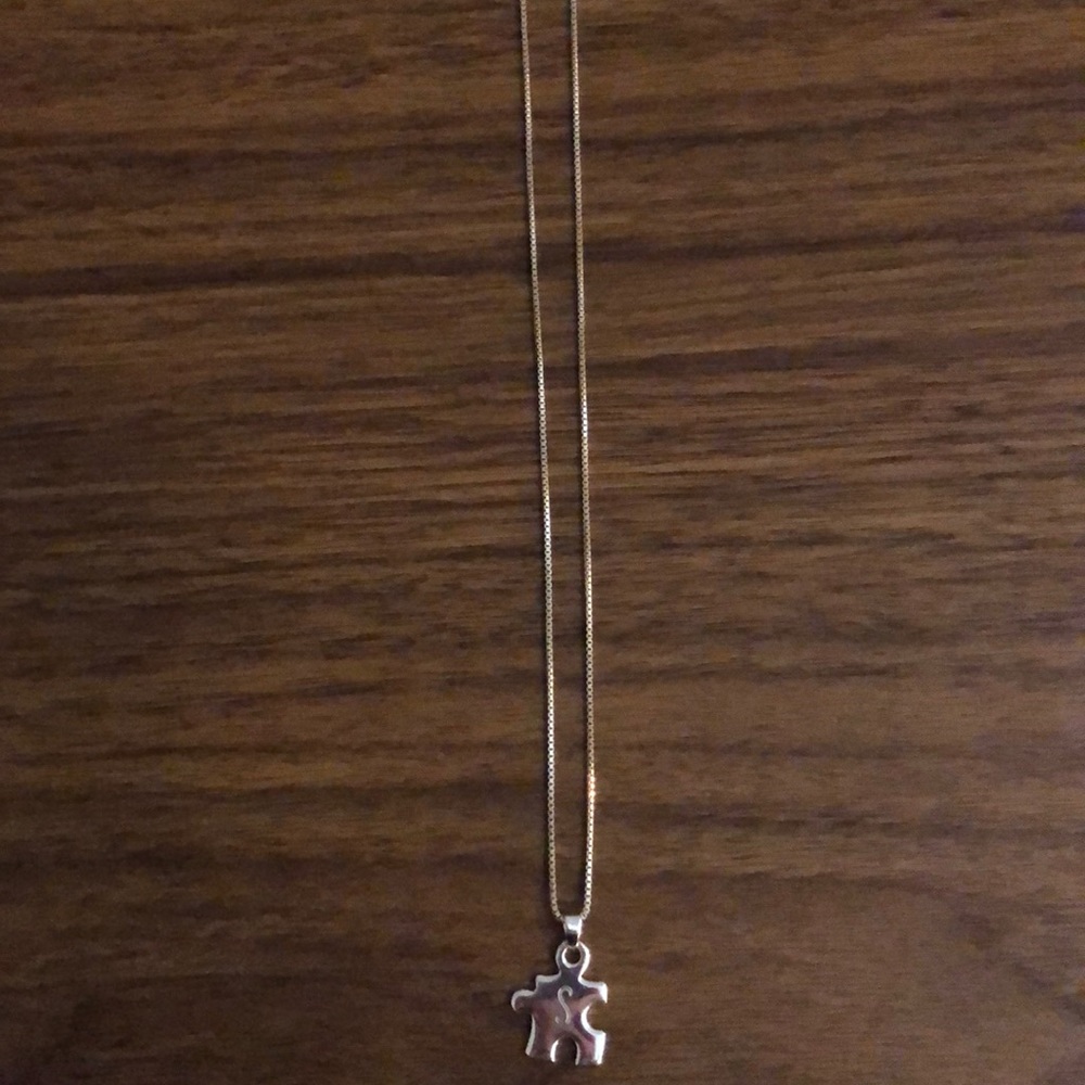 Sterling silver “S” puzzle piece necklace